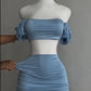 A sexy and fashionable two-piece short skirt with hollowed-out pleated puffed sleeves that wraps the hips